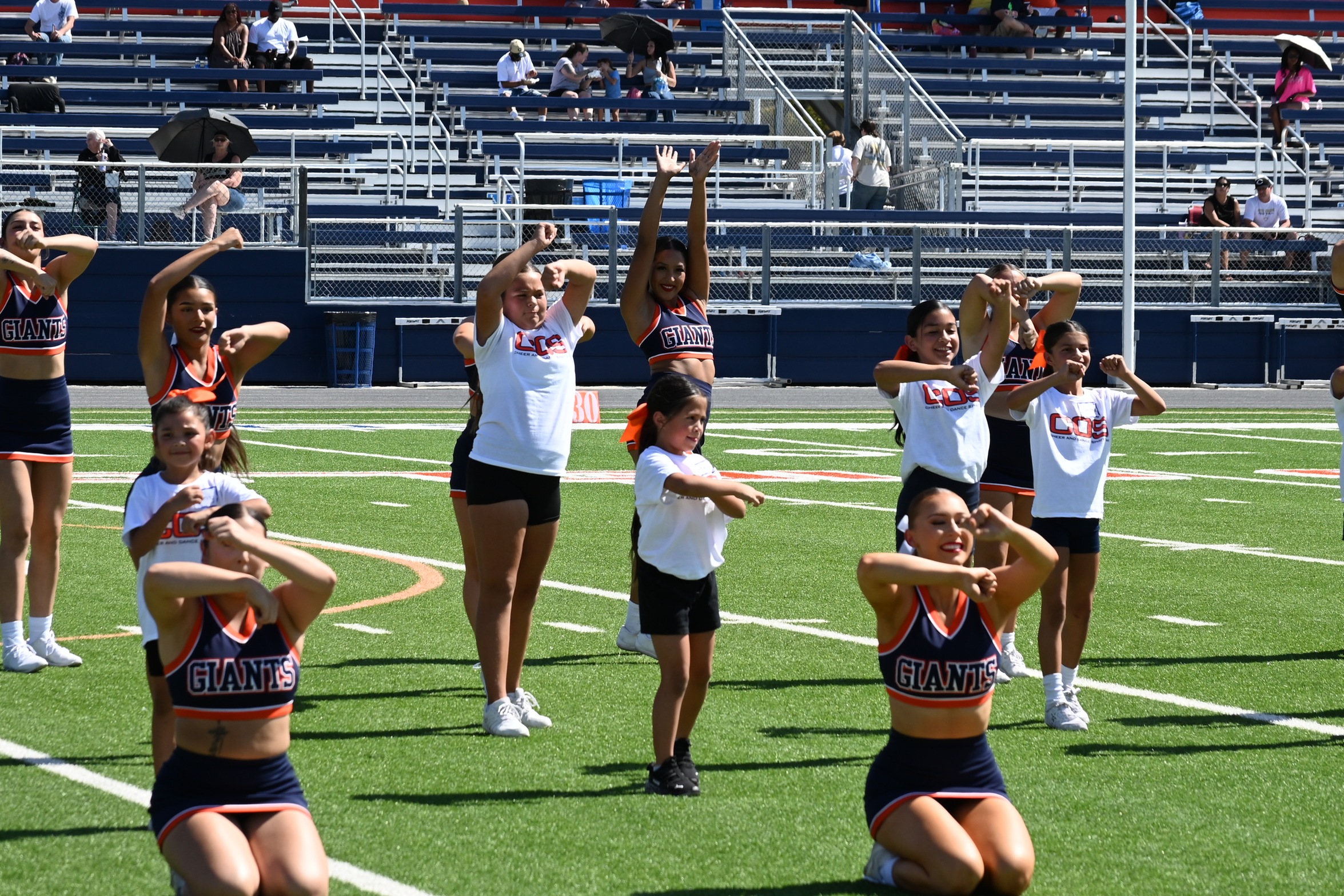 College of the Sequoias' cheer team during Spirit Day at halftime of the College of the Sequoias and Butte football game. (Norma Foster / COS Athletics)