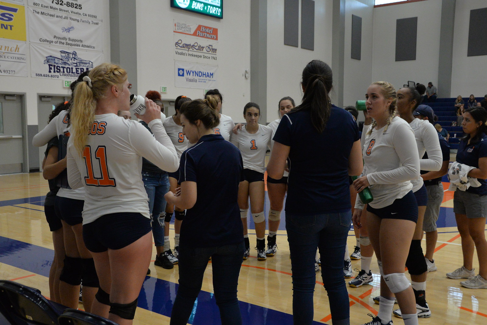 Volleyball huddles up during a break.
