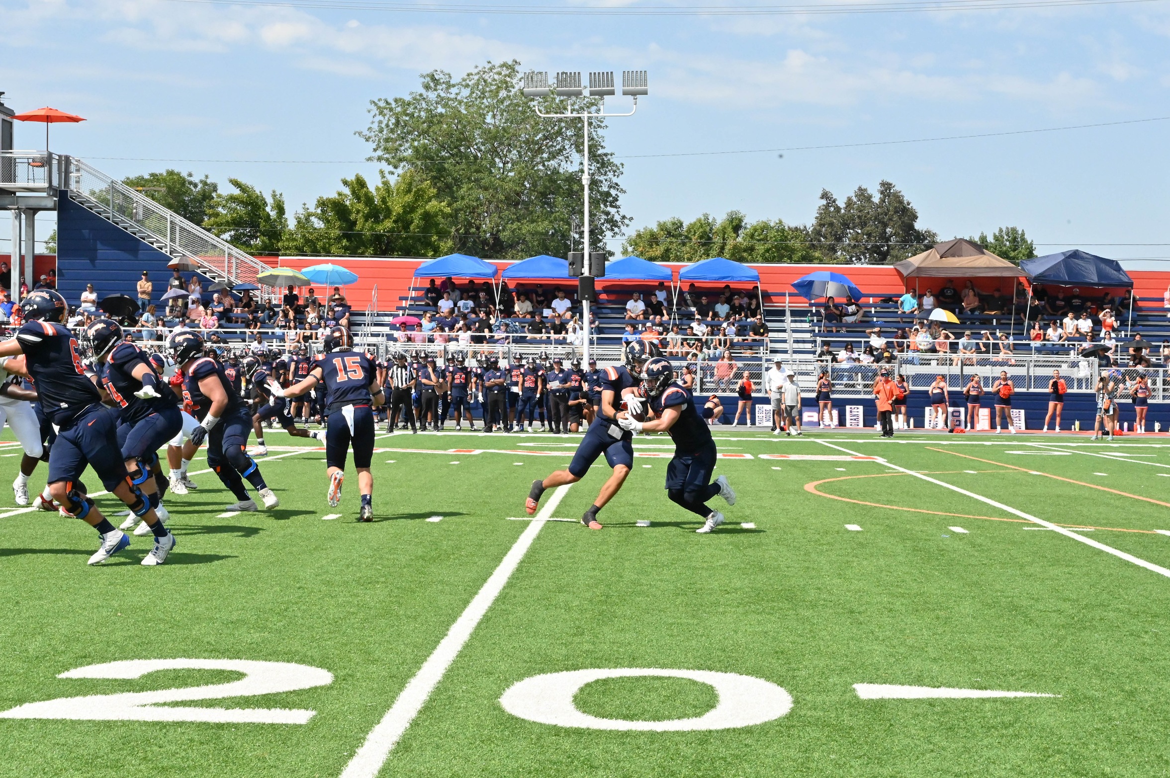 Dalton Armbruster receives a handoff from Reilly Garcia in a game earlier this season versus American River on September 7, 2024. (Photo Credit: Norma Foster / COS Athletics)