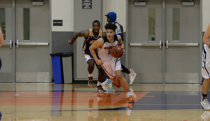 Isaiah Johnson dribbling up the court. The guard had a team-high 15 points on Wednesday.
