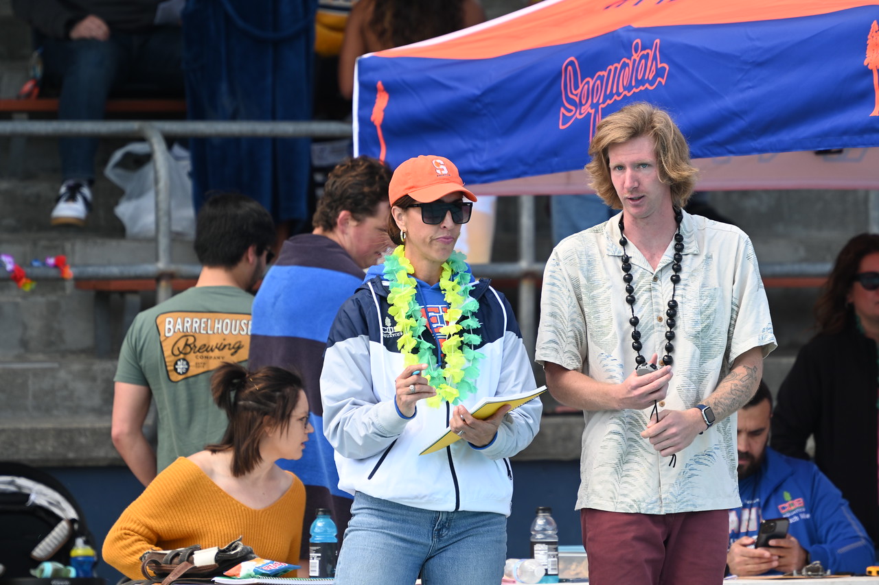 COS Head Coach Ally Briano looks on during a meet earlier in the season.