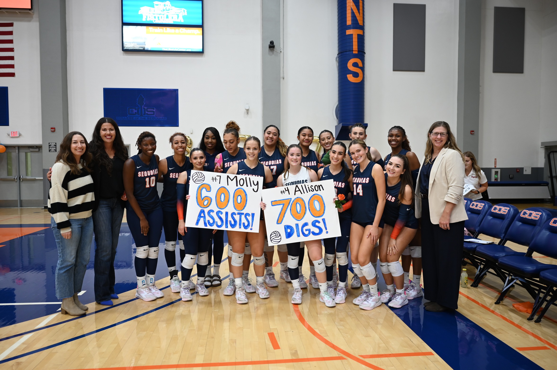 College of the Sequoias' volleyball team celebrating the milestones of Molly Forehan (600 assists) and Allison Wood (700 digs) after their win versus Lemoore College on November 14, 2025. (Norma Foster / COS Athletics)